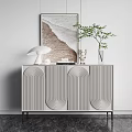 Minimalist Modern Entryway Console Table With Curved Pattern Doors Green Plant Lamp And Artwork