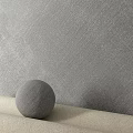 Gray Textured Wall Design With Gray Sphere On Light Colored Surface