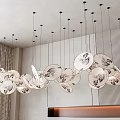 Elegant Modern Chandelier With Multiple Circular Plates And Artistic Patterns In Interior Room