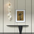 Foyer Hallway Interior With Black Console Table And Framed Artwork On Light Colored Walls