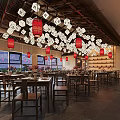 Traditional Chinese Restaurant Interior With Wooden Ceiling Red Drums Wine Racks Counter And Chandeliers
