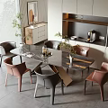 Modern Kitchen Dining Area With Marble Top Dining Table And Stylish Chairs And Plants