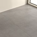 Gray Floor Tiles Laid in Indoor Space With Natural Light From Window