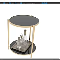 Modern Round Coffee Table With Golden Legs Glass Top Lower Black Tray And Transparent Bottles