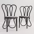Modern Leisure Chairs With Curved Black Metal Frame And Gray Padded Seat