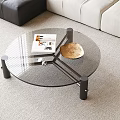 Modern Round Glass Top Coffee Table With Black Metal Legs Gold Bowl And Magazine