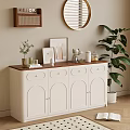 White Sideboard with Wooden Top Arched Doors Framed Pictures and Round Mirror in Living Area