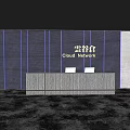 Textured Reception Desk with Cloud Network Sign Textured Wall and Laptops