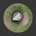 Round Green Grass Circle With Large Rock And Bare Soil Patch