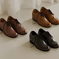 Different Colored Leather Shoes In Brown Dark Brown Black With Laces On Light Background