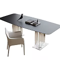 Modern Black Desk With Glass Top Metal Frame Light Colored Chair Books And Decorative Bird