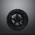 Motorcycle Tire With Black Rubber Tread And Alloy Wheel Rim Design