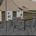 Cozy Camping Site With Beige Tent Table Chairs Fire Pit Bamboo Fence And Chinese Calligraphy Banners