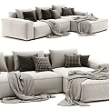 Cozy Sectional Sofa With Plush Pillows Striped Blankets And Neutral Fabric Upholstery