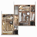 Cutlery Set Organized in Drawer with Wooden Dividers and Stainless Steel Utensils