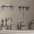 Different Styles of Modern Metal Water Faucets Mounted on Wall and Countertop