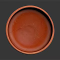 Intricate Hand Sculpted Orange Clay Bowl With Artisanal Textured Surface Design
