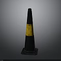 Black And Yellow Striped Traffic Cone With Base Mat On Gray Background