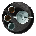 Elegant Celadon Ceramic Teaset With Teapot And Teacups On Black Tray