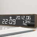 Wooden Digital Clock with Time Date Temperature Display and Paper Pencil on Desk
