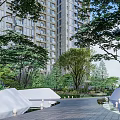 Urban Garden Landscape With High rise Buildings Lush Trees And Paved Walkway
