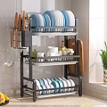 Kitchen Multi Tier Dish Rack With Plates Bowls Knives Cutting Board Fruits And Potted Plant