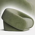 Green Velvet Single Seater Sofa With Curved Design And Modern Minimalist Style
