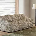 Floral Patterned Sectional Sofa In Neutral Tones With Wooden Blinds Floor Lamp And Green Rug