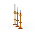 Three Orange Decorative Candle Holders With White Candles On White Background