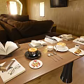 Decorative Ornament Set With Open Book Coffee Cup Tableware And Small Plates On Wooden Table