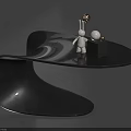 Modern Black Side Table with Curved Smooth Surface and Decorative Rabbit Figurine Gold Sphere Black Cube