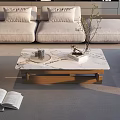 Marble and Black Glass Coffee Table with Wooden Frame and Books Glasses in Living Room
