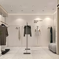 Modern Clothing Store Interior With White Walls Hanging Clothes Racks Sofa Shoes And Green Plant