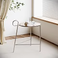 Modern Minimalist Side Table With Metal Frame And Glass Top Near Window Curtains