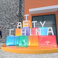 Outdoor Tasty China Display With Colorful Blocks And Man Walking By