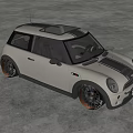 Small Silver Gray Car with Black Roof and Black Wheels in Spacious Modern Indoor Space
