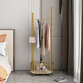 Stylish Gold Clothing Rack In Bedroom With Hanging Clothes Handbag And Storage Basket