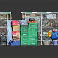 Organized Household Supplies Storage With Green Boxes Multiple Baskets Bags And Metal Shelves