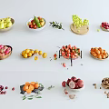 Assorted Fresh Fruits with Green Herbs in Bowls and Scattered on White Surface