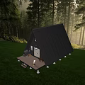Black A Frame Cabin In Forest With Wooden Deck And Outdoor Furniture On Lawn