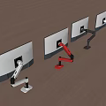 Different Design Monitor Arms With Red White And Silver Colors On Wooden Floor