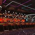 Modern Bar Interior Design With Comfortable Sofas Wine Bottles Large Screen And Decorative Lights 3d model