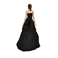 Elegant Woman In Black Strapless Floor Length Formal Gown With Flowing Skirt