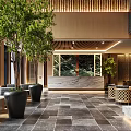 Modern Hotel Lobby Interior With Chandelier Green Plants And Wooden Panels