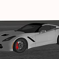 Gray Sports Car With Sleek Design Black Wheels And Red Brake Calipers On Open Road
