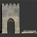 Medieval Stone Tower Structure With Crenellated Top Archway And Studio Sign