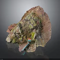 Natural Rock Formation With Vibrant Pink Green Yellow Hues And Textured Surface