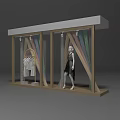 Store Window Design Featuring Mannequin In Black Dress Hanging White Clothes And Colorful Decorative Strips