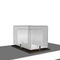 Square Frosted Glass Table Lamp With Metal Base And Soft Warm Light On White Tabletop