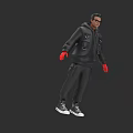 A Man In Black Hooded Jacket Black Pants Red Gloves Sunglasses On Gray Background